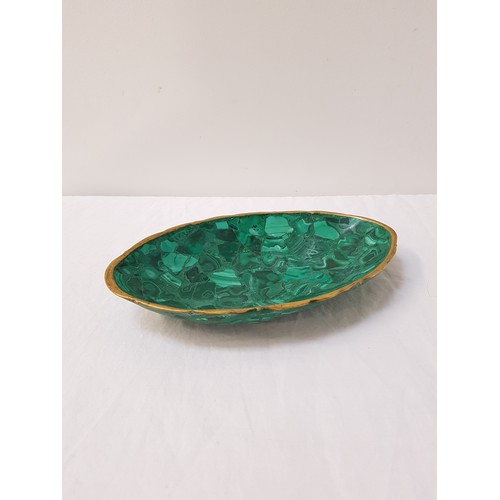 301 - GREEN MALACHITE OVAL DISH
with a gold painted rim, 23.5cm wide