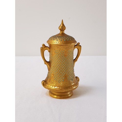 251 - COALPORT TURQUOISE JEWELLED URN
with two shaped handles, the cover with a gilt finial, 12cm high