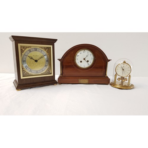 337 - SHAPED MAHOGANY CASED MANTLE CLOCK
the circular dial with Arabic numerals, with a presentation plaqu... 