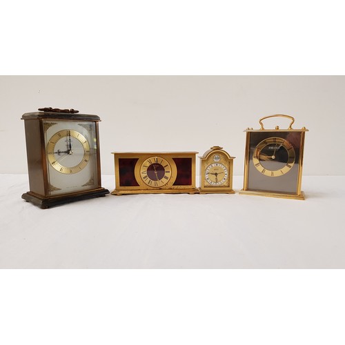 338 - SWIZA BRASS AND FAUX TORTOISESHELL MANTLE CLOCK
the circular dial with Roman numerals; together with... 