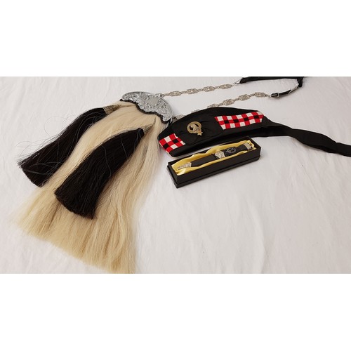 389 - MILITARY STYLE SPORRAN
with white horse hair and two black horse hair tassels, with a fancy square s... 