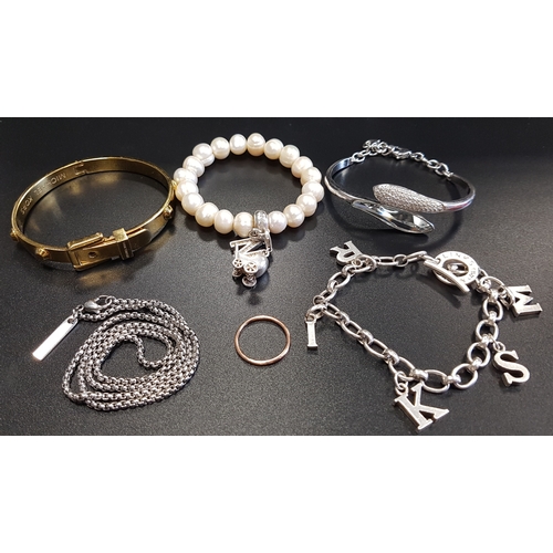 111 - SELECTION OF FASHION JEWELLERY 
comprising a Michael Kors gold tone buckle bangle; a Thomas Sabo pea... 