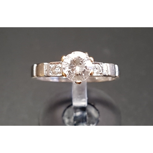 84 - CZ SOLITAIRE RING
on Egyptian eighteen carat white gold shank with further small CZ stones to the sh... 