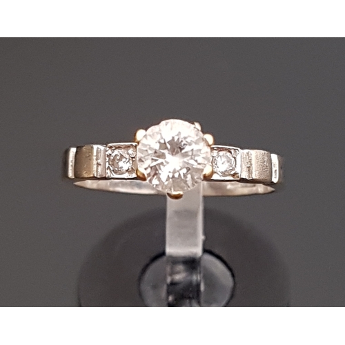 84 - CZ SOLITAIRE RING
on Egyptian eighteen carat white gold shank with further small CZ stones to the sh... 