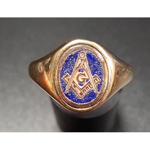 90 - NINE CARAT GOLD REVOLVING MASONIC SIGNET RING
the revolving centre with blue enamel and compass deco... 