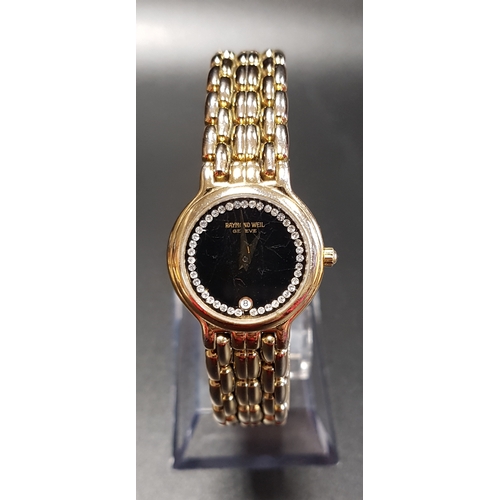 107 - LADIES RAYMOND WEIL EIGHTEEN CARAT GOLD PLATED WRISTWATCH
the black dial with date aperture at 6 and... 