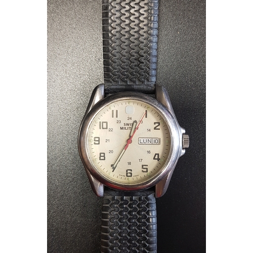 113 - GENTLEMAN'S SWISS MILITARY WRISTWATCH
the cream guilloche enamel dial with Arabic numerals and day a... 