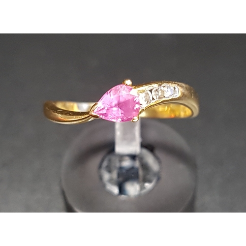 70 - PINK SAPPHIRE AND DIAMOND RING
the pear cut pink sapphire with three diamonds to one side of the twi... 