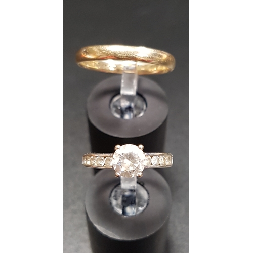 146 - CZ SET NINE CARAT WHITE GOLD RING
size I and approximately 1.9 grams; together with a nine carat gol... 