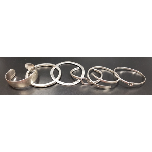 156 - SIX SILVER BANGLES
including a twist example and another with wave design (6)