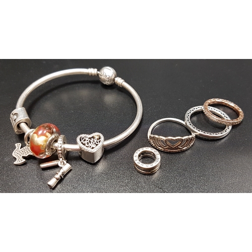 174 - SELECTION OF SILVER PANDORA JEWELLERY
comprising a Moments silver bangle with five charms, three rin... 