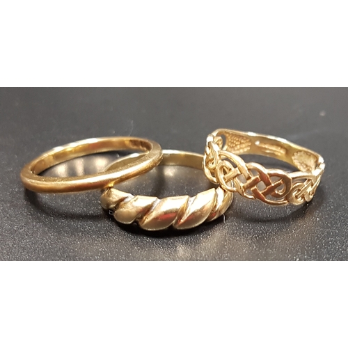 176 - THREE NINE CARAT GOLD RINGS
one with pierced Celtic knot decoration, total weight approximately 4.6 ... 