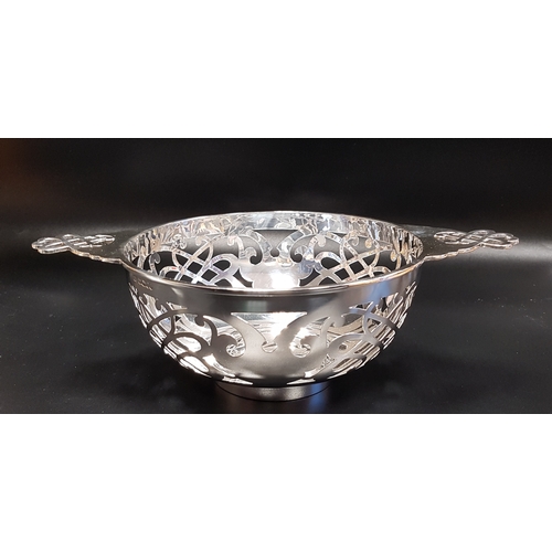 210 - GEORGE V PIERCED SILVER CENTRE BOWL
in the form of a quaich, Sheffield 1934, 348 grams