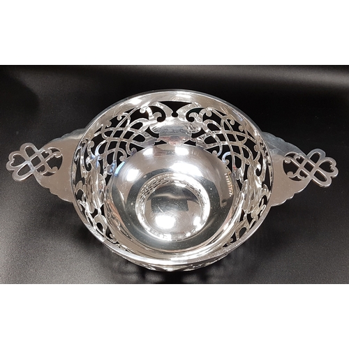 210 - GEORGE V PIERCED SILVER CENTRE BOWL
in the form of a quaich, Sheffield 1934, 348 grams