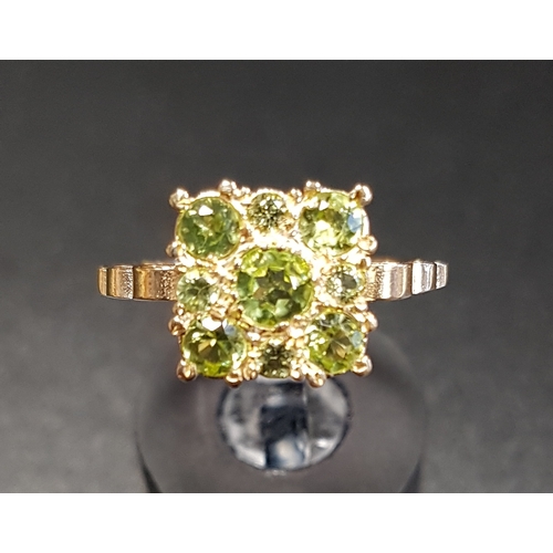 85 - PERIDOT CLUSTER RING
the nine graduated peridots in square setting, on nine carat gold shank, ring s... 