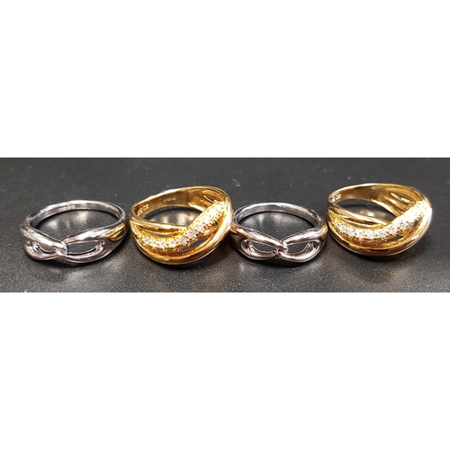 202 - FOUR SILVER RINGS
two CZ set gilt crossover examples and two with interlocking design (4)