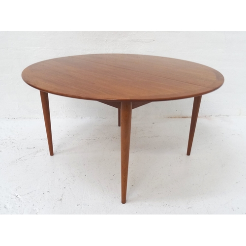 484 - DANISH TEAK CIRCULAR DINING TABLE
by Poul Jeppesen, with a pull apart top standing on turned taperin... 