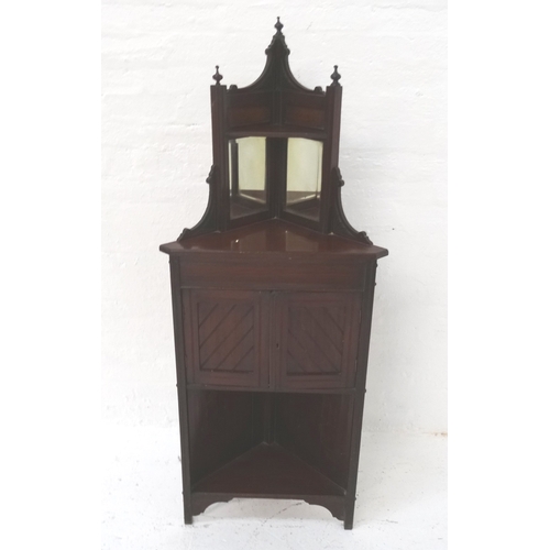 489 - EDWARDIAN MAHOGANY FLOOR STANDING CORNER CABINET
the shaped top with three finials with a shelf belo... 