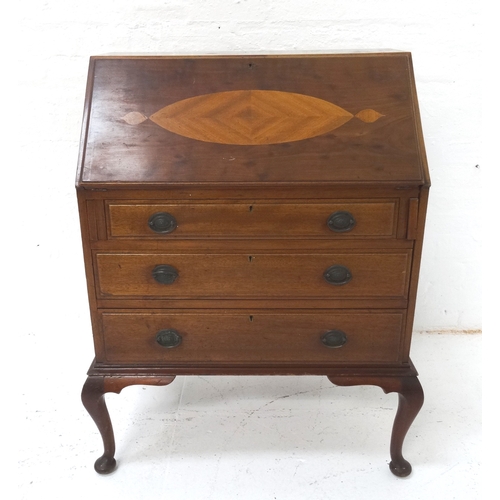 492 - MAHOGANY BUREAU
with a crossbanded fall flap opening to reveal a fitted interior above three long dr... 