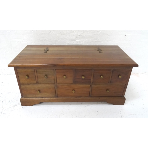 509 - MAHOGANY LOW OCCASIONAL TABLE
modelled as a chest with a lift up lid with decorative hinges above an... 