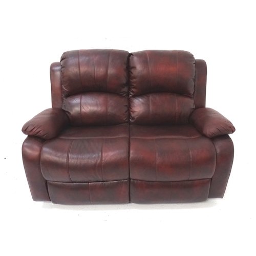 512 - FAUX LEATHER TWO SEAT SOFA
in claret with manually operated reclining seats, 145cm wide