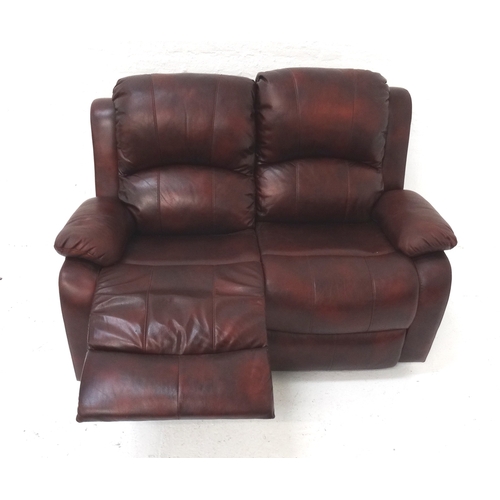 512 - FAUX LEATHER TWO SEAT SOFA
in claret with manually operated reclining seats, 145cm wide