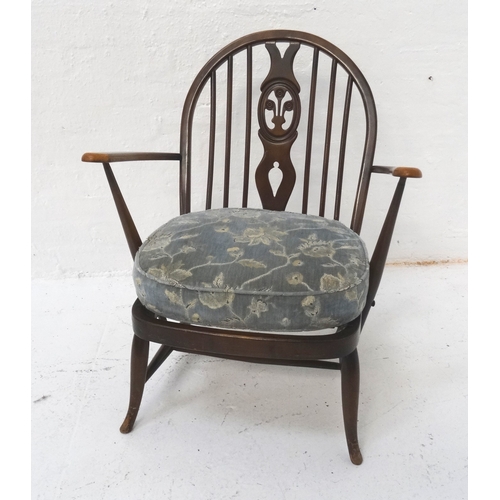 520 - ERCOL STICKBACK ARMCHAIR
with a shaped back with a central splat above a pair of shaped arms with a ... 