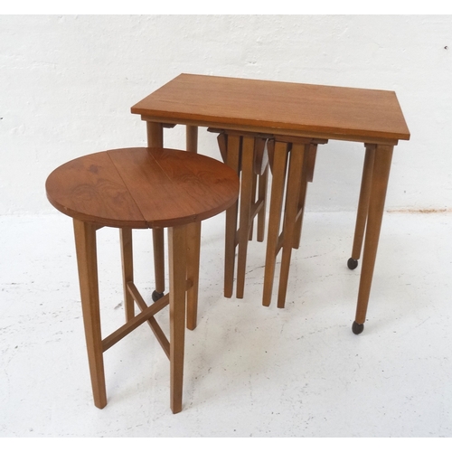 524 - NEST OF TEAK OCCASIONAL TABLES
with a rectangular top standing on tapering supports with castors, wi... 