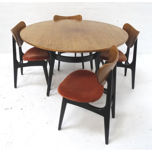 533 - G PLAN TEAK DINING TABLE
with a circular top standing on shaped ebonised supports, 121cm diameter, t... 