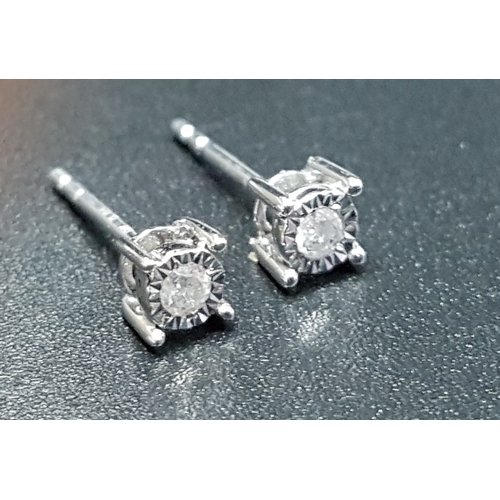 137 - PAIR OF ILLUSION SET DIAMOND STUD EARRINGS
the diamonds totalling approximately 0.1cts, in nine cara... 