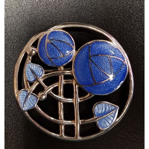 138 - BLUE ENAMEL DECORATED SILVER BROOCH
the circular brooch with Mackintosh rose decoration, 3.7cm diame... 