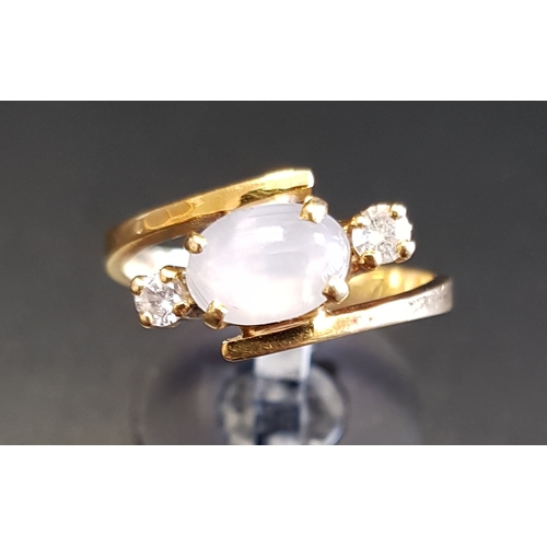 160 - MOONSTONE AND DIAMOND CROSSOVER DRESS RING
the central oval cabochon moonstone flanked by round bril... 