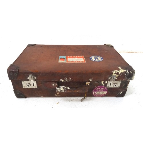 372 - VINTAGE LEATHER SUITCASE
with reinforced corners and vintage Cunard Line travel labels, 66.5cm wide