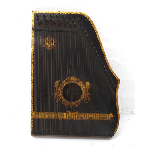 385 - MENZENHAUER GUITAR ZITHER
with a shaped ebonised body and applied transfer border decoration, 49cm l... 