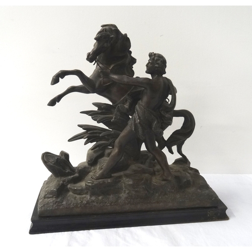 374 - TWO SPELTER FIGURINES
each depicting a man trying to control a rearing horse, raised on ebonised rec... 