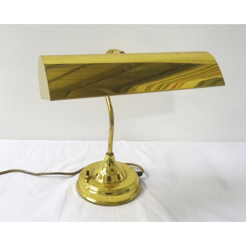 515 - BRASS DESK LAMP
raised on a circular base with a shaped column and adjustable lamp hood