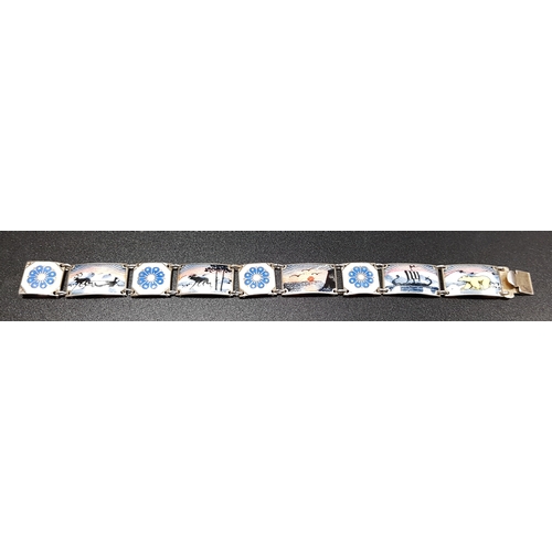 83 - NORWEGIAN ENAMEL DECORATED SILVER BRACELET
the rectangular links with reindeer, a sunset, a galleon ... 