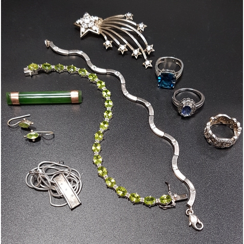 124 - SELECTION OF SILVER AND GOLD JEWELLERY
including a peridot line bracelet, an unmarked gold mounted  ... 