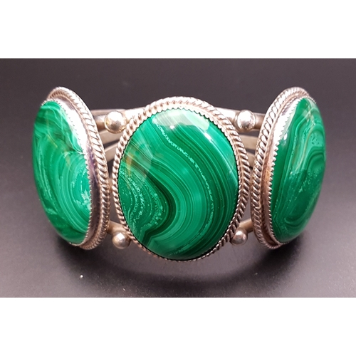 149 - LARGE MALACHITE SET SILVER BRACELET
with three oval malachite sections, with indistinct maker's mark