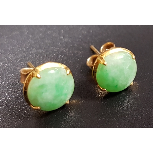 166 - PAIR OF CIRCULAR JADE STUD EARRINGS
in unmarked gold, the butterflies marked 750