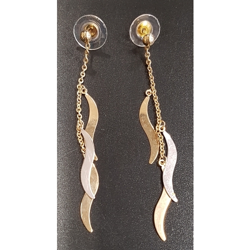 134 - PAIR OF TWO TONE NINE CARAT GOLD DROP EARRINGS
each earring with three wavy drops