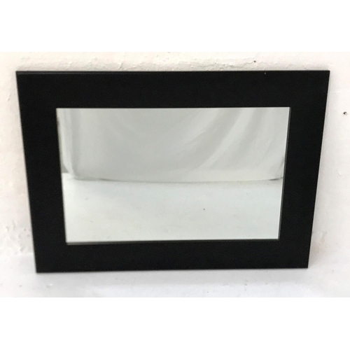 536 - JOHN ROCA WALL MIRROR 
with a dark stained wooden frame, 81cm x 111cm