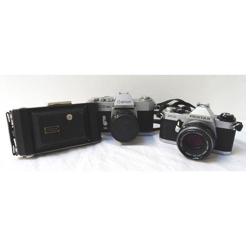 329 - PHOTOGRAPHIC INTEREST
including a 35mm Canon EXEE, Pentax MG 35mm and a cased Kodak camera