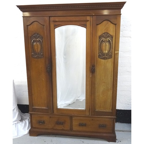 496 - ART NOUVEAU MAHOGANY WARDROBE
with a moulded dentil cornice above a shaped central bevelled mirror d... 