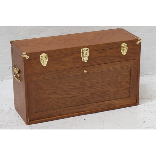 316 - LIGHT OAK COLLECTORS CABINET
with a rectangular lift up lid with reinforced brass corners opening to... 