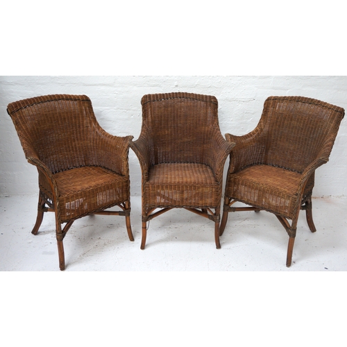 324 - SET OF THREE CANED CONSERVATORY TYPE ARMCHAIRS
with shaped backs and arms, standing on bamboo suppor... 