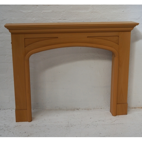 326 - BEECH FIRE SURROUND
with a moulded top above an arched opening, 115cm x 147cm