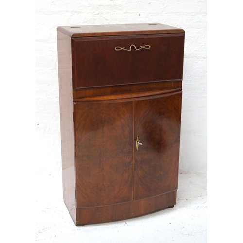 332 - FIGURED WALNUT DRINKS CABINET
with a fall flap and rise up top revealing an illuminated and slide ou... 