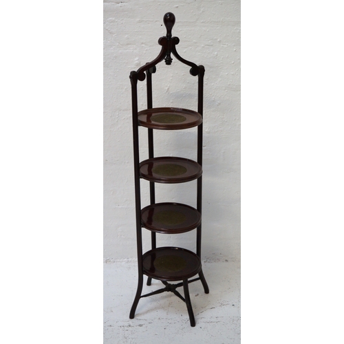 346 - EDWARDIAN MAHOGANY CAKE STAND
the four circular tiers with inset linen sections, with three shaped s... 