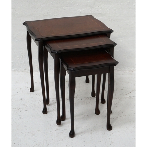 325 - MAHOGANY NEST OF TABLES
with cross banded tops above a plain frieze, standing on cabriole supports, ... 